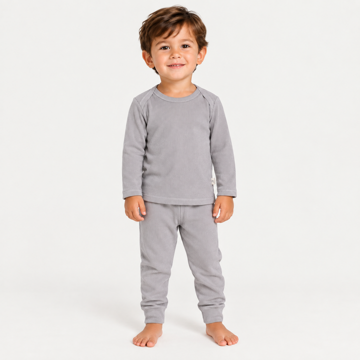 Toddler wearing PAIGELAUREN Gray Rib Lap Tee + Legging Set