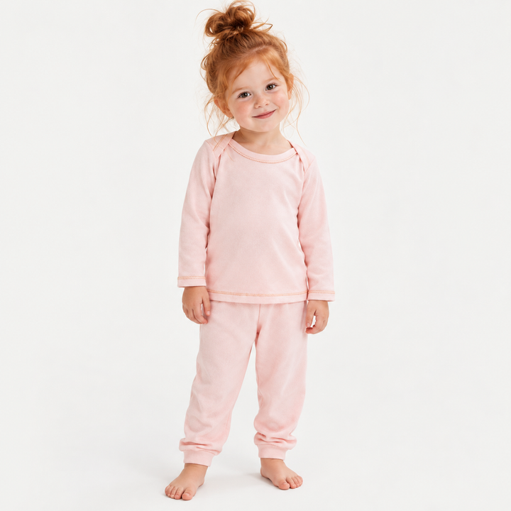Toddler wearing PAIGELAUREN Pink Rib Lap Tee + Legging Set