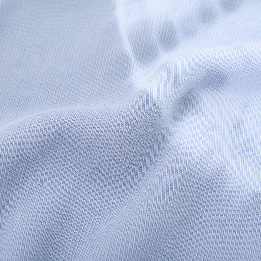 Close-up of soft rib knit and hand-dyed gray and blue color variation on PAIGELAUREN pajama