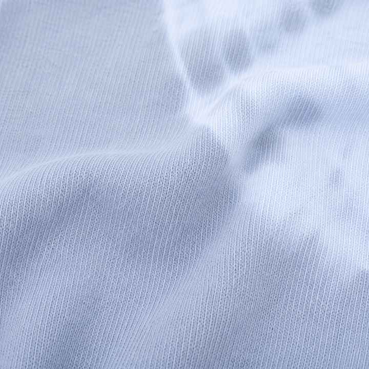 Close-up of soft rib knit and hand-dyed gray and blue color variation on PAIGELAUREN pajama