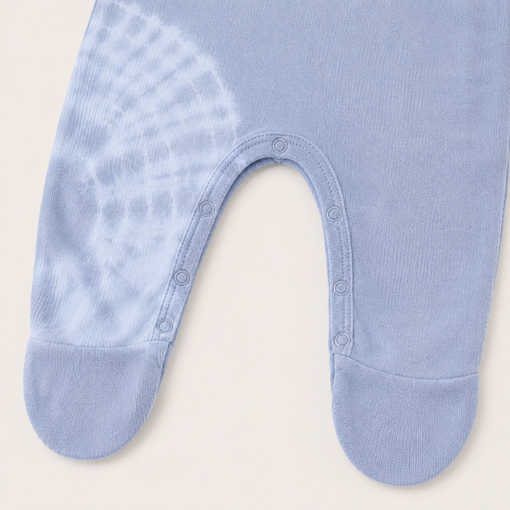 Inseam snap closure and footie detail of PAIGELAUREN gray and blue Rib Tie Dye Pajama