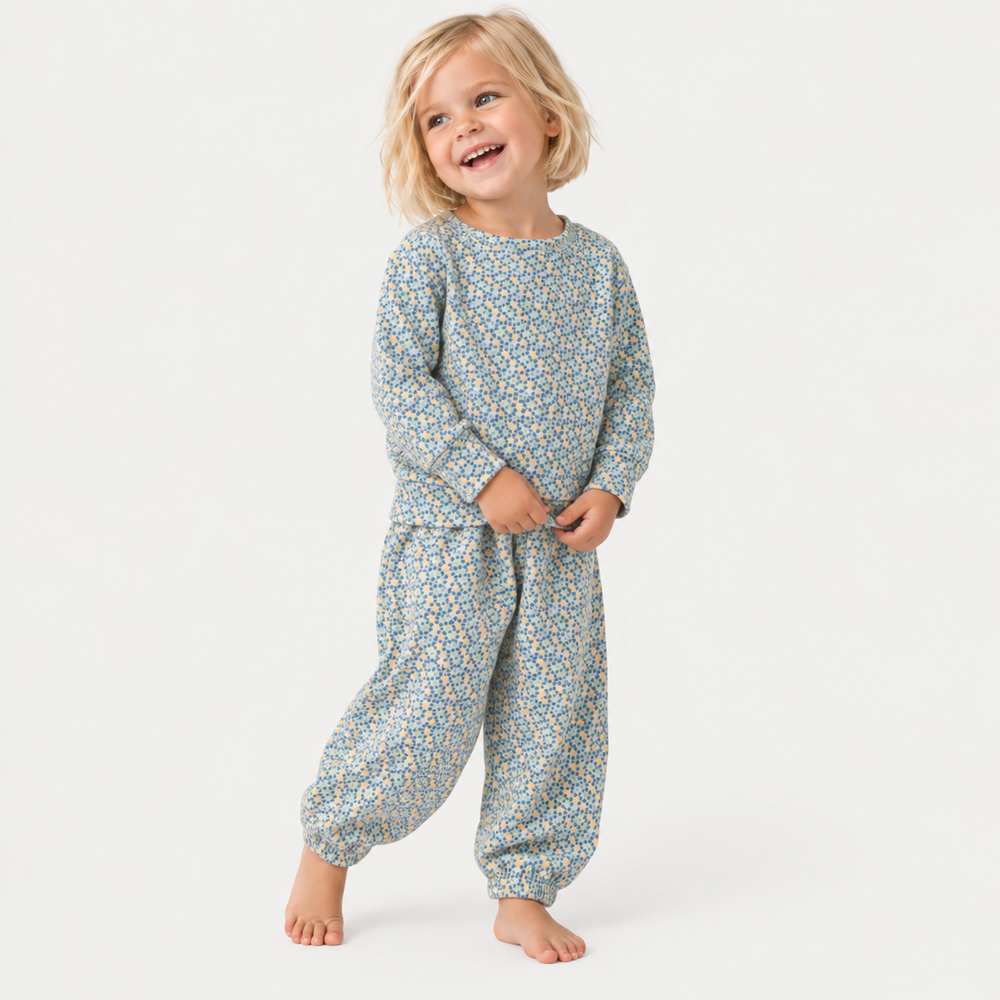 Child wearing PAIGELAUREN Sage Polka Dot Sweatshirt and Sweatpant Set