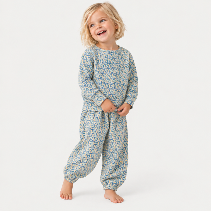 Child wearing PAIGELAUREN Sage Polka Dot Sweatshirt and Sweatpant Set