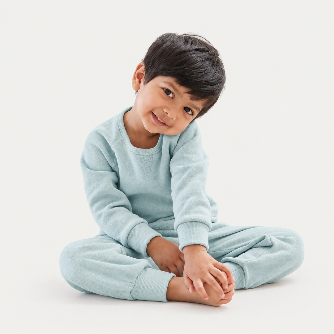 Toddler wearing PAIGELAUREN Sage Sherpa Raglan Sweatshirt and Jogger Set