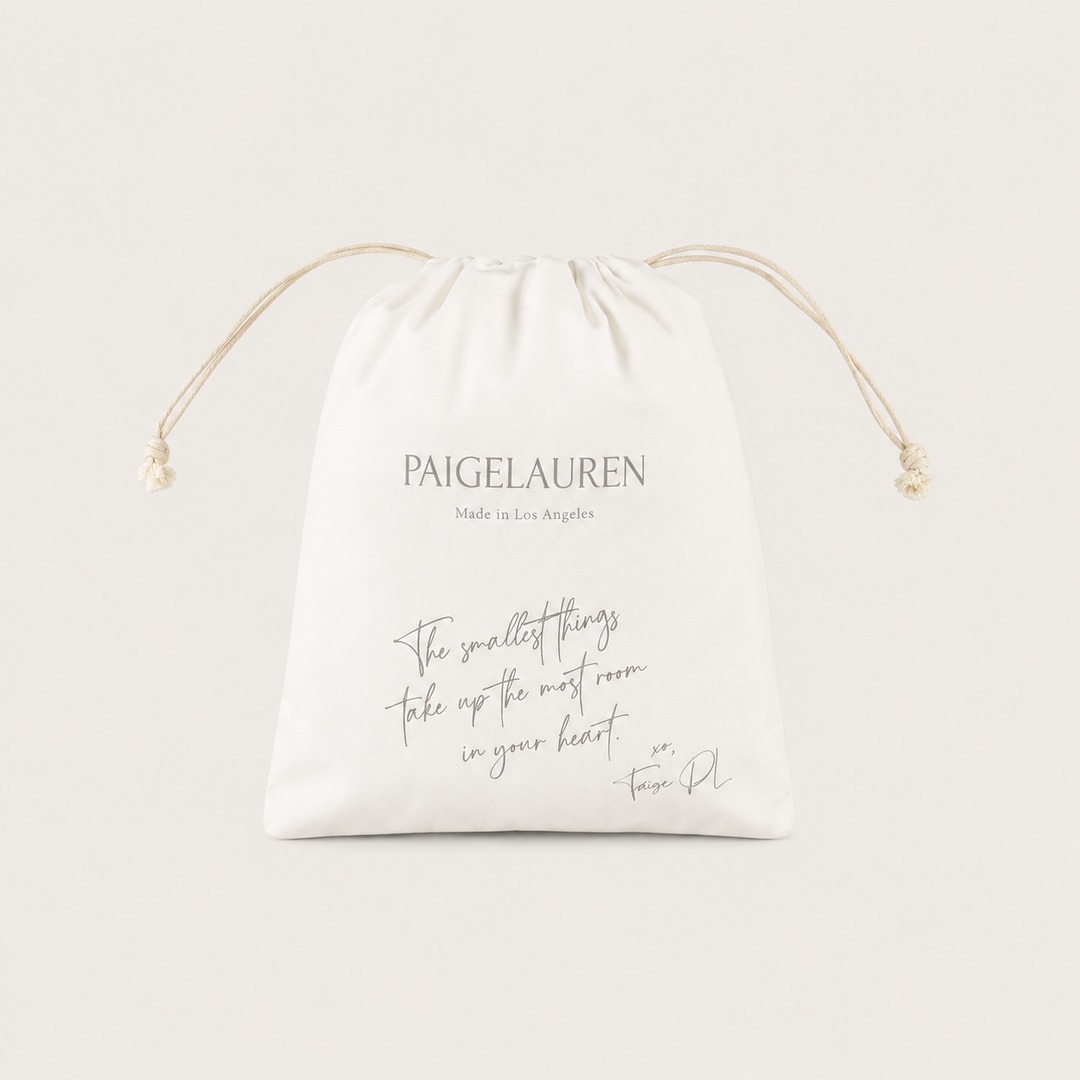 PAIGELAUREN Signature Gift Bag in ivory with drawstring closure and Made in Los Angeles branding