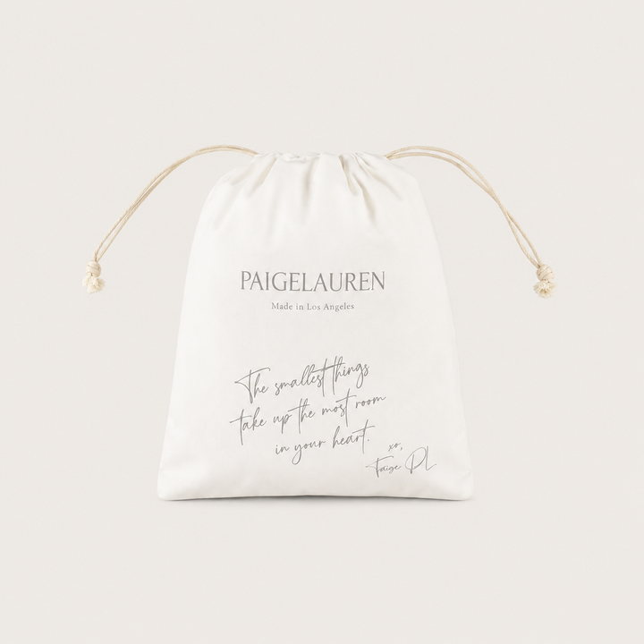 PAIGELAUREN Signature Gift Bag in ivory with drawstring closure and Made in Los Angeles branding