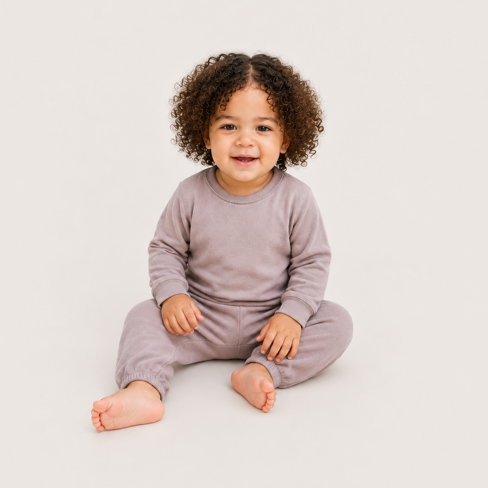Baby sitting and wearing PAIGELAUREN Lightweight Hacci Pullover & Pant Set in Taupe