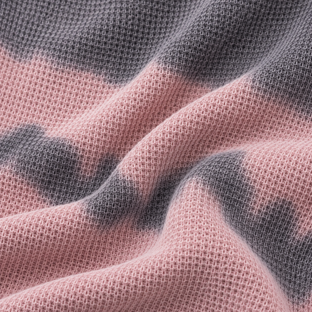 Close-up of PAIGELAUREN Gray Pink hand-dyed thermal fabric texture