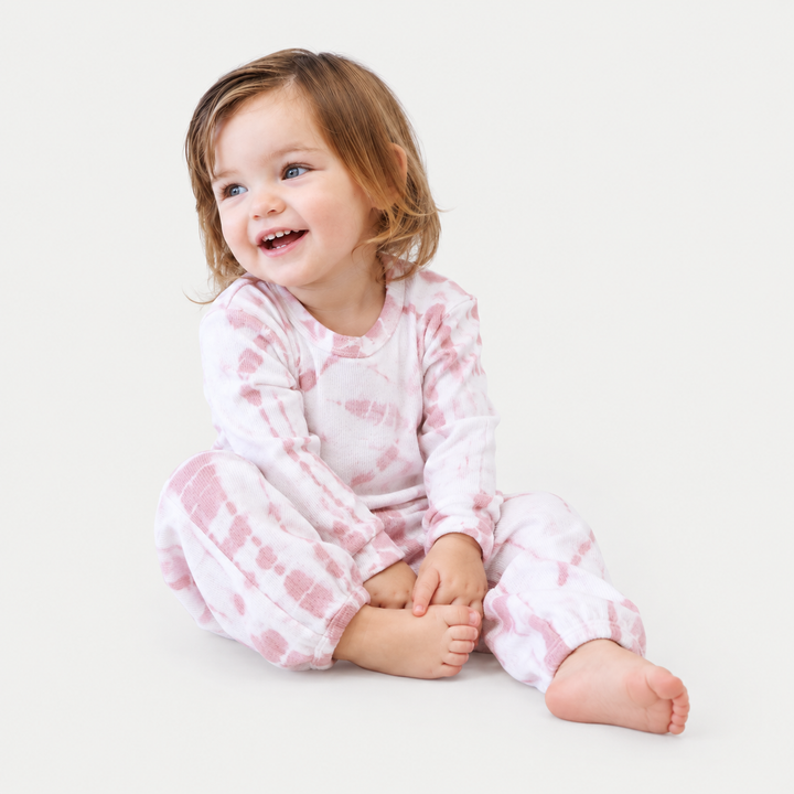Toddler wearing the PAIGELAUREN Rose Pink tie dye baby rib set