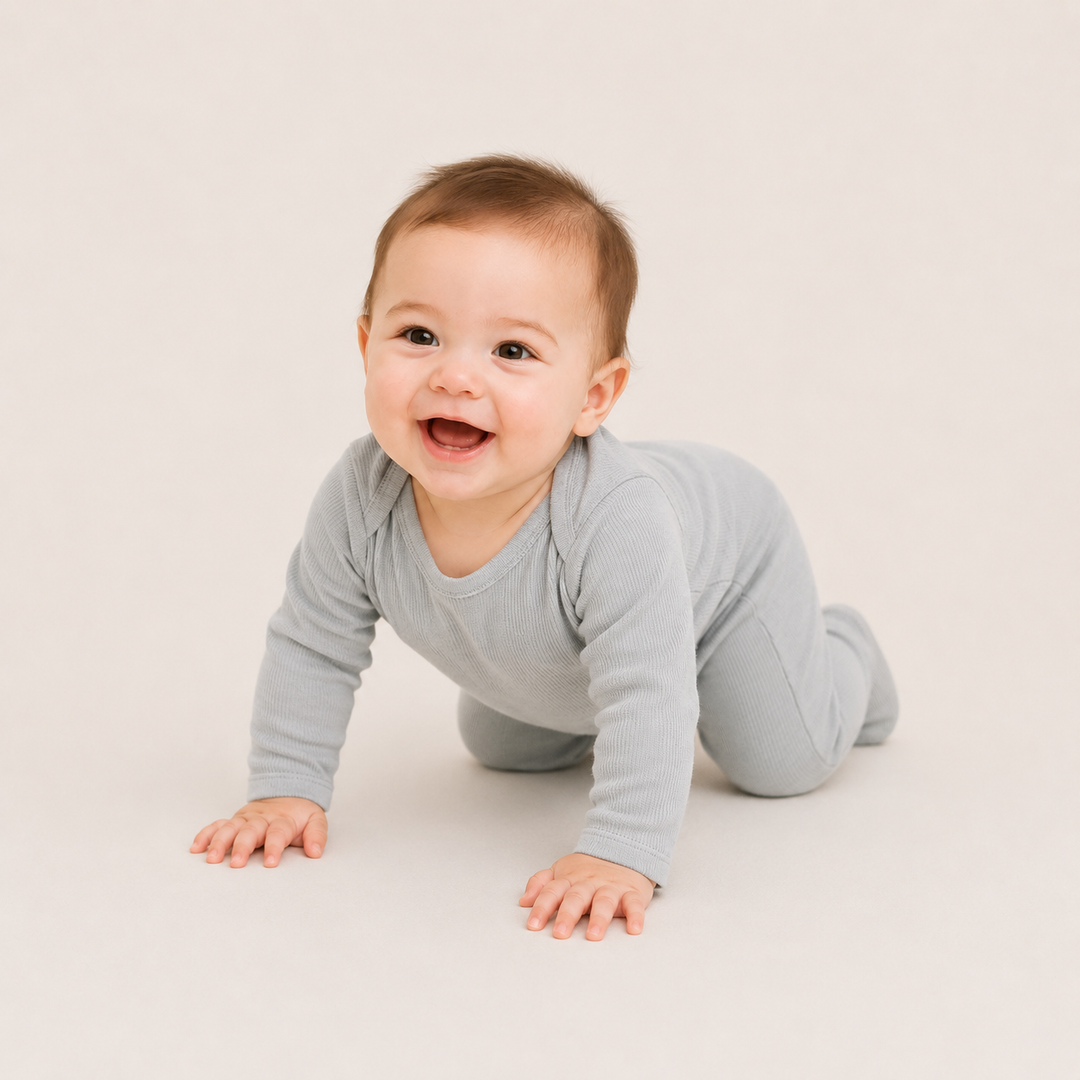 Baby crawling in PAIGELAUREN Variegated Rib Lap Tee Footie Gray Pajama