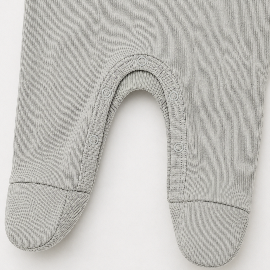 Built-in footie and mixed rib texture detail on PAIGELAUREN baby pajama Gray