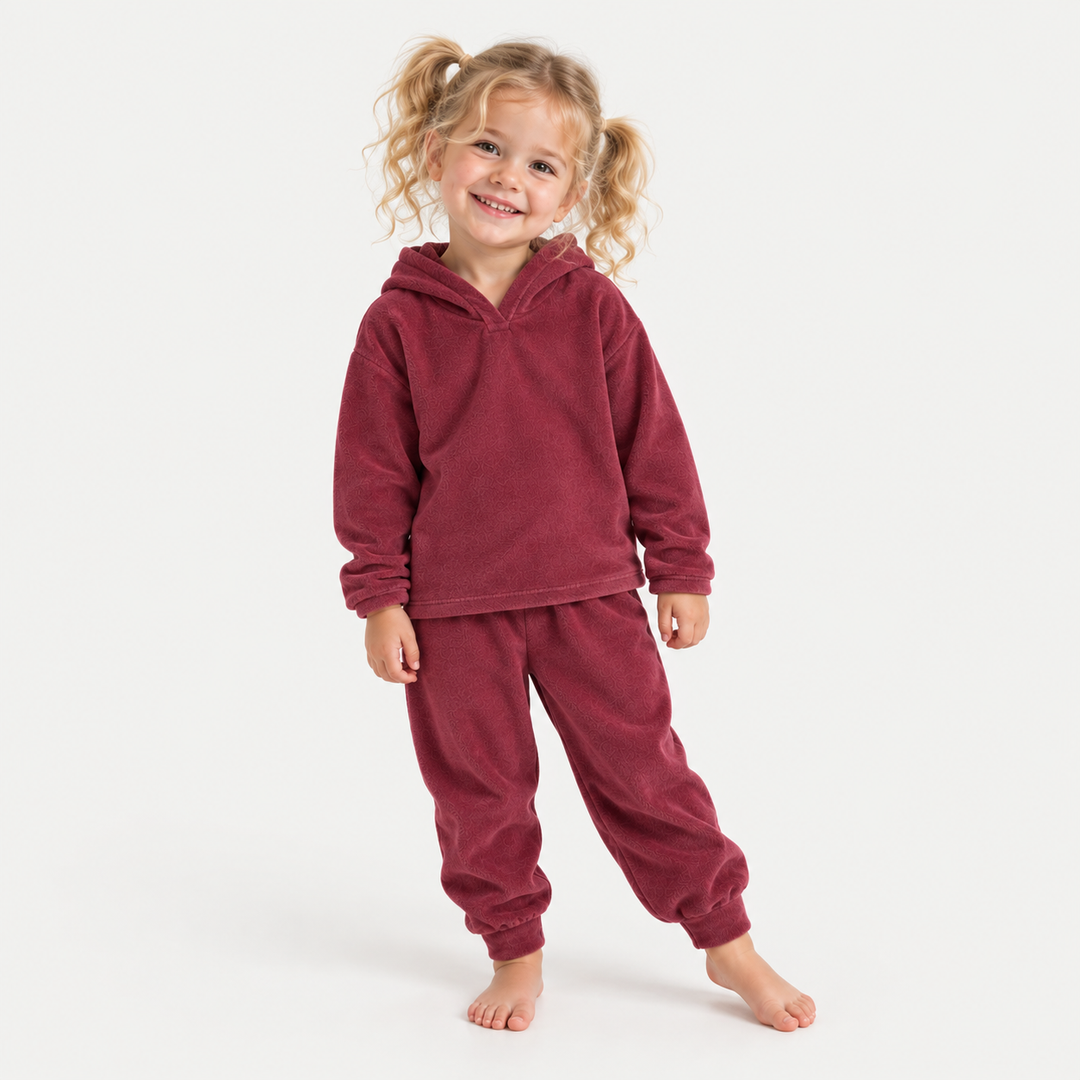 Toddler modeling the PAIGELAUREN Burgundy velour hoodie and jogger set