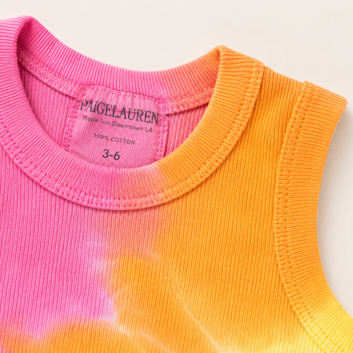 Close-up of the ribbed crew neckline, binding, and hand-dyed rainbow finish on the PAIGELAUREN Pink Rainbow Ribbed Tank Overall