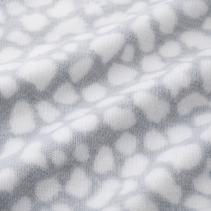 Close-up of ultra-soft gray animal print brushed hacci fabric by PAIGELAUREN