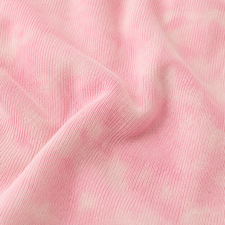 Close-up of premium marble dyed rib knit fabric on the PAIGELAUREN Rib Marble Henley Romper